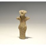 "5th-4th millennium BC. A terracotta figurine with pinched facial features, stub arms and