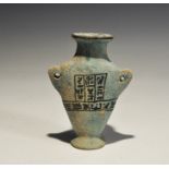 "20th century AD. A blue glazed composition heart-shaped jar with flared foot, lateral lug