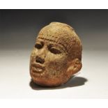 ". An undated archaistic female face with braided cap and pellets to the lower edge; flat top ,