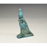 ". An undated archaistic bright blue glazed composition figurine of Horus in sparrowhawk form with