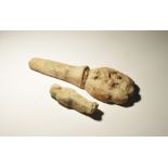 "20th century AD. A pair of ceramic items comprising: a shabti with tripartite wig; a hand and