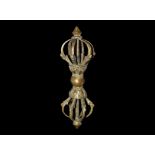 20th century AD. A bronze sceptre modelled on the vajra with median bulb and lotus-flower sockets,