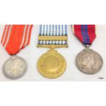 A Queen Elizabeth 1953 Coronation Medal with a UN Korea Medal and a Japanese Red Cross Medal