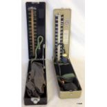 2 Military blood pressure testers in a Bakelite case and 1 in a metal case