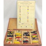 An unusual boxed set of 88 hand painted wooden Naval signal flags each flag being approximately
