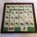Framed collection of silk Empire cigarette flags