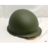 A reproduction MI US military helmet