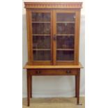 A Victorian oak glazed bookcase on trestle base 177h x 102w x 37d