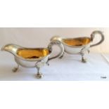 A pair of gilt interior finished sauce boats