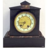 A striking slate mantle clock