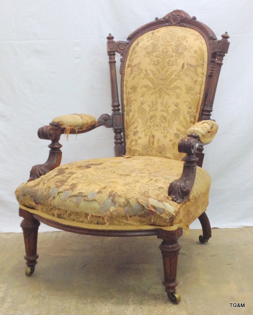 A Victorian mahogany carved framed nursing chair