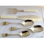 Silver serving spoons and silver fish knife and server