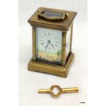 A small picture carriage clock with key 8cm high