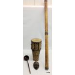 Four items of Tribal Art to include a bongo drum, a mask, a didgeridoo and a ladle