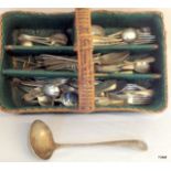 A collection of silver plate flatware including silver/military ladle