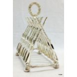 A silver plated toast rack of military rifles