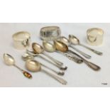 A collection of hallmarked silver including spoons and napkin rings