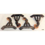 A set of 4 antique cast iron bed casters by Vono