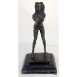 A bronze dominatrix figurine