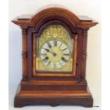 An Oak Mantle Clock fitted a German 2 Train movement striking on a gong with key and pendulum 36cm