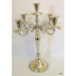 A silver plated five sconce candelabra