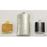 A hand beaten pewter Hip flask and 2 others