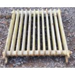 A cast iron radiator 91cm high x 85cm wide