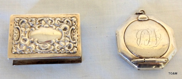 a silver compact together with a silver match box holder