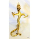 An oriental brass dragon standing