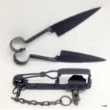 A Victorian steel animal trap with a pair of Victorian steel sheep shears