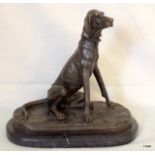 A bronze figure of a hunting hound stands 25cm