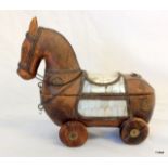 A carved wooden horse ink well with mother of pearl inlay