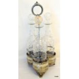 A Victorian silver plated Tantalus with 3 matching cut glass decanters