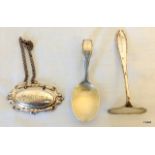 A Christening spoon, pusher and a decanter label