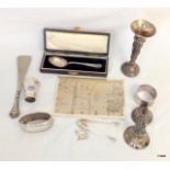 A mixed lot of silver items to include christening spoons, sugar tongs a shoe horn and other items