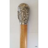 An antique Indian/ Burmese silver topped Malacca walking cane