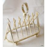 A silver plated toast rack in the form of cricket bats