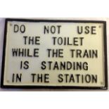 A cast metal 'Railway Toilet' sign