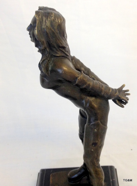 A Bronze Dominatrix Figurine