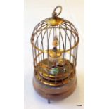 A brass automaton bird cage clock