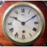 Elliott's of London 8 day ships bulkhead brass clock with military markings to the back plate (E.R