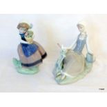 A Lladro figurine of a girl holding a flowerpot 5223-f30N and a Lladro figurine of a lady and a