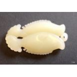 A carved Chinese White Jade twin fish pendant length 7.2cm