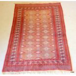 A Persian style rug in red with orange and blue pattern 200 x 126
