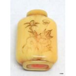 An antique Chinese marine ivory snuff bottle carved with a poem