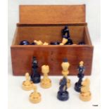 A painted wooden chess set in wooden box 32 pieces