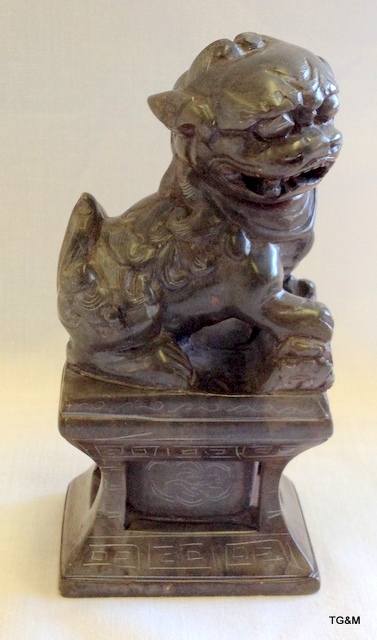 Chinese carved soapstone figure of a Lion/Fo dog on a plinth 18cm high