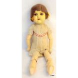 An 'Armand Marseille' German porcelain headed articulated doll model no 390 50cm long