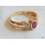 A ladies 9ct gold ruby and diamond ring. size P