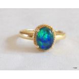 A ladies 9ct gold opal ring size N